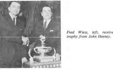 Fred Wiess receives trophy from John Heeney