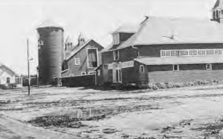 Hog barn, extreme right, Milk house, beef barn and silo, 1941